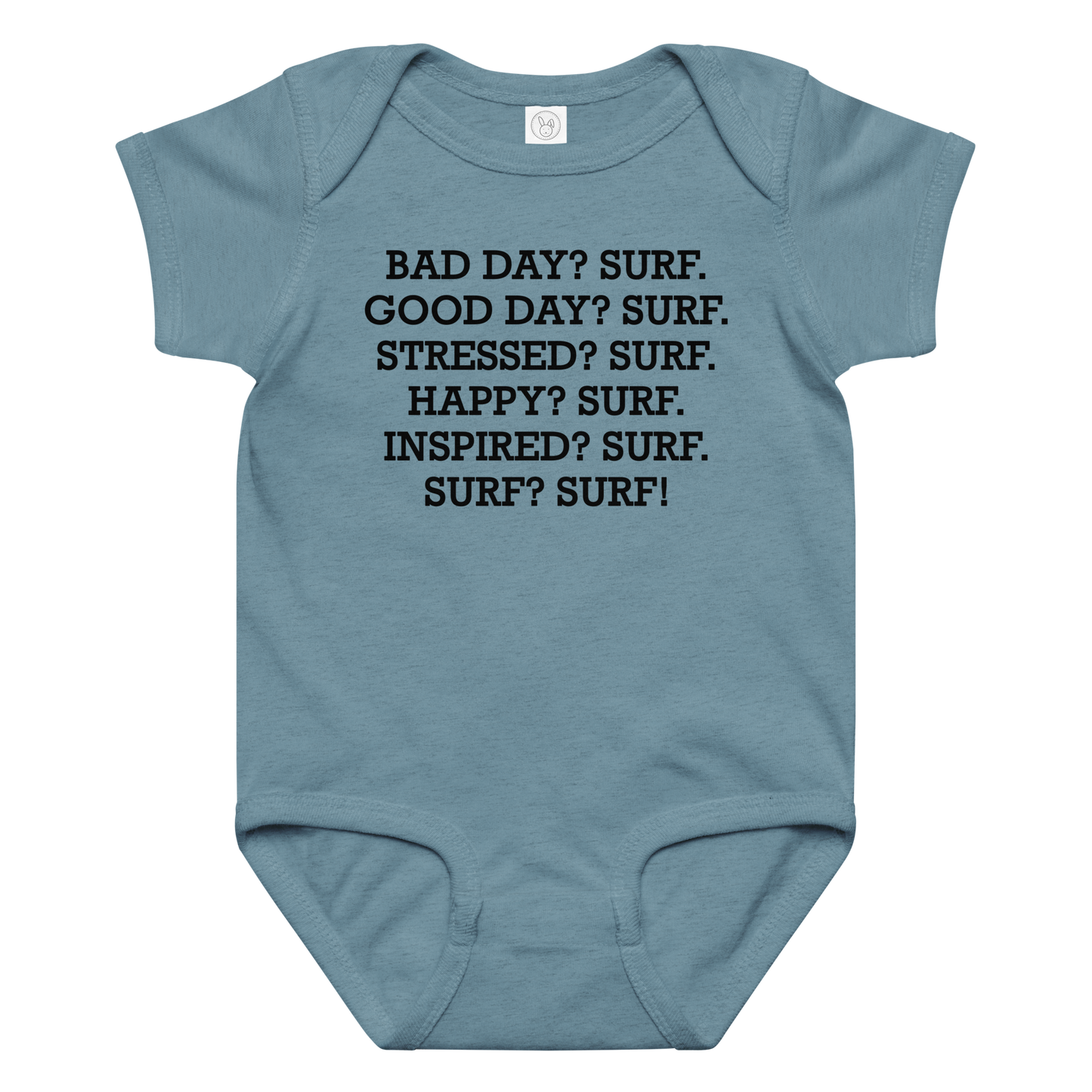"Bad Day? Surf. Good Day? Surf. Stressed? Surf. Happy? Surf. Inspired? Surf. Surf? Surf!" printed on a vintage indigo baby jersey bodysuit laying on a flat surface amongst other clothes