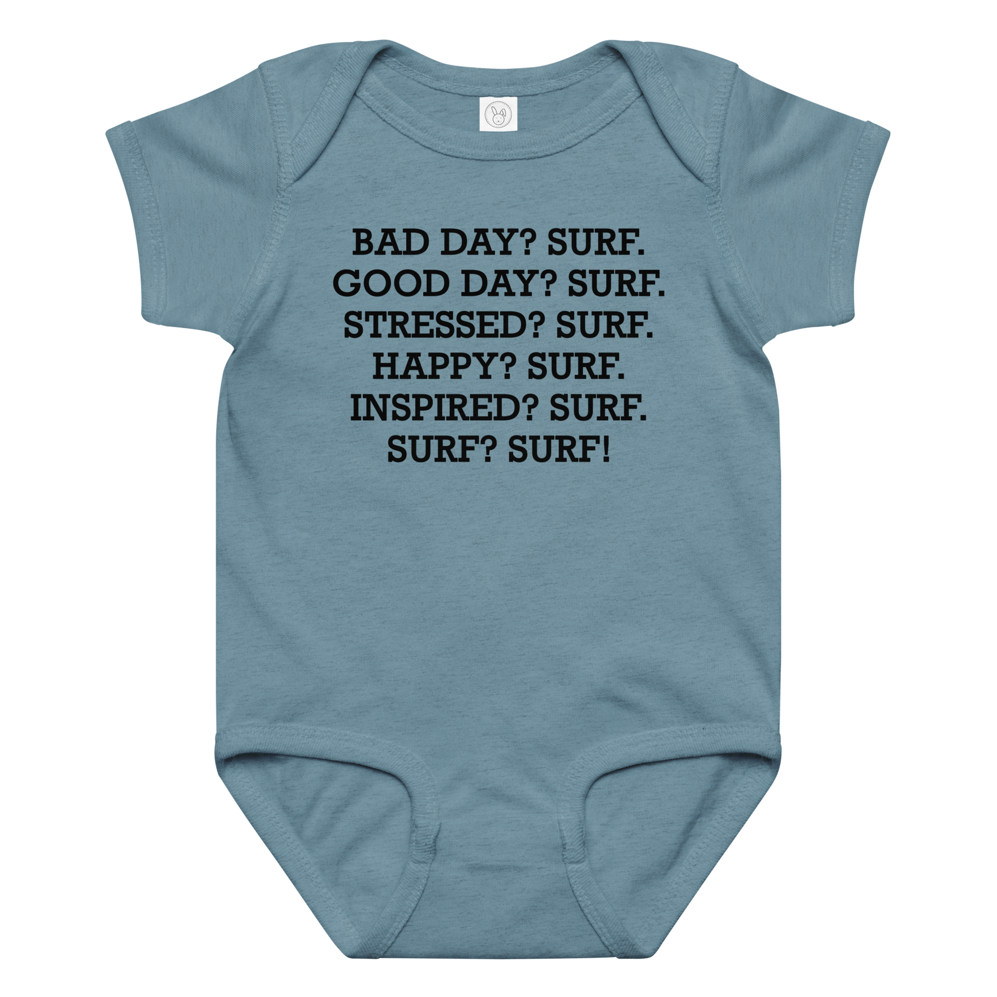 "Bad Day? Surf. Good Day? Surf. Stressed? Surf. Happy? Surf. Inspired? Surf. Surf? Surf!" printed on a vintage indigo baby jersey bodysuit laying on a flat surface amongst other clothes