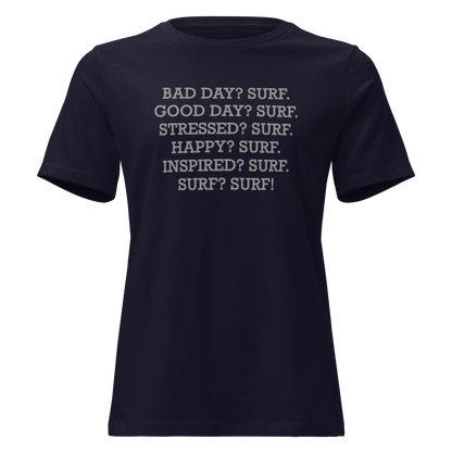 "Bad Day? Surf. Good Day? Surf. Stressed? Surf. Happy? Surf. Inspired? Surf. Surf? Surf!" printed on a navy on an invisible / simulated body