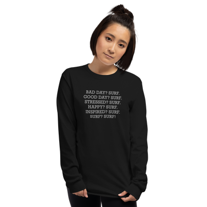 "Bad Day? Surf. Good Day? Surf. Stressed? Surf. Happy? Surf. Inspired? Surf. Surf? Surf!" printed on a black men's long sleeve shirt worn by a female