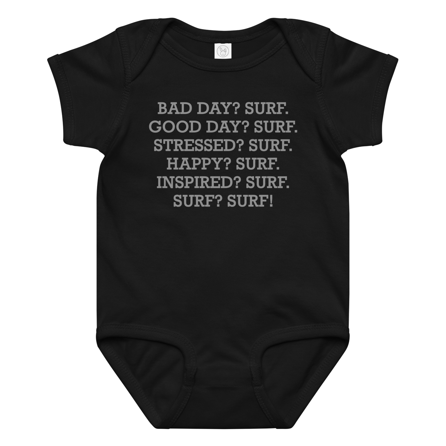 "Bad Day? Surf. Good Day? Surf. Stressed? Surf. Happy? Surf. Inspired? Surf. Surf? Surf!" printed on a black baby jersey bodysuit laying on a flat surface amongst other clothes