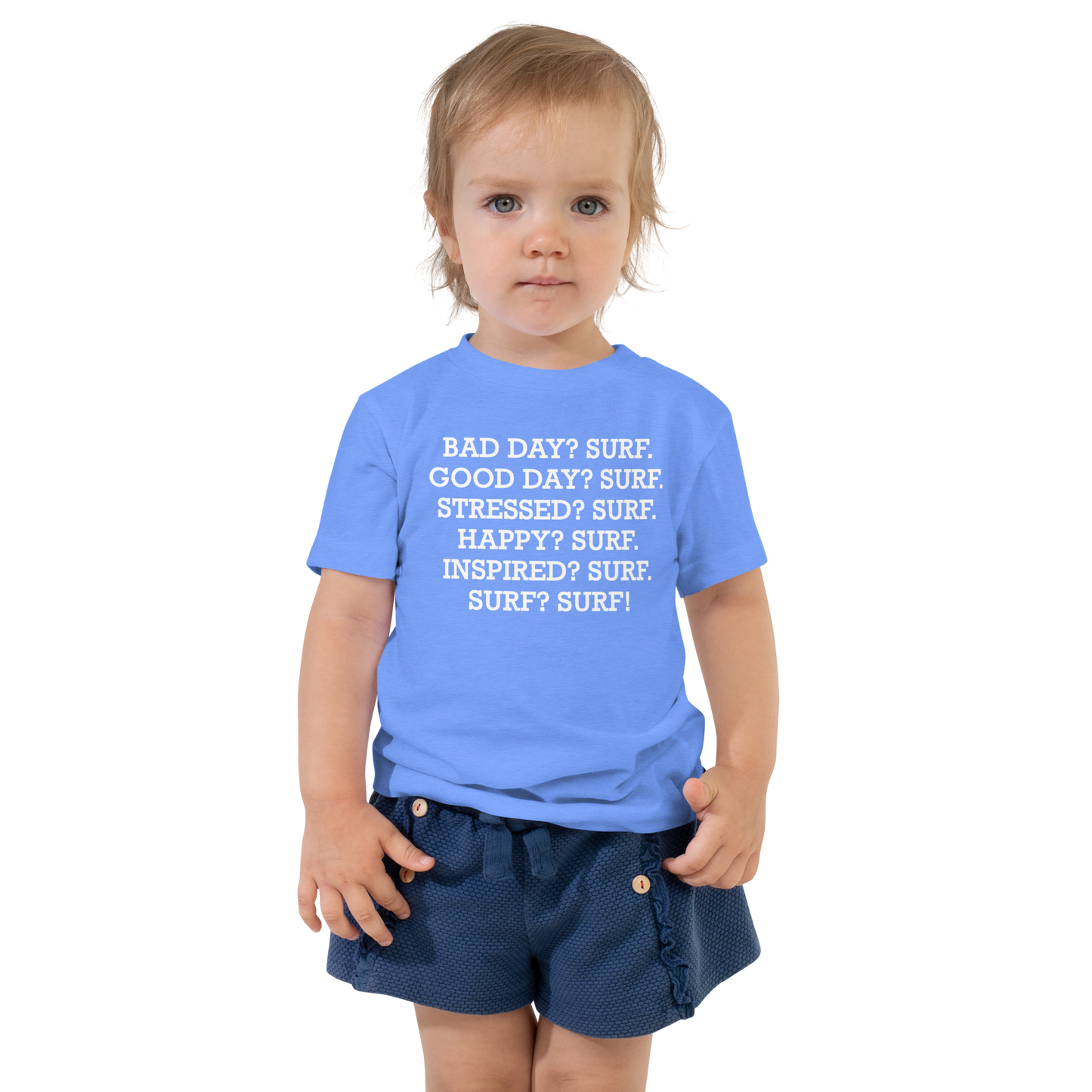"Bad Day? Surf. Good Day? Surf. Stressed? Surf. Happy? Surf. Inspired? Surf. Surf? Surf!" printed on a heather columbia blue toddler short sleeve tee worn by a female