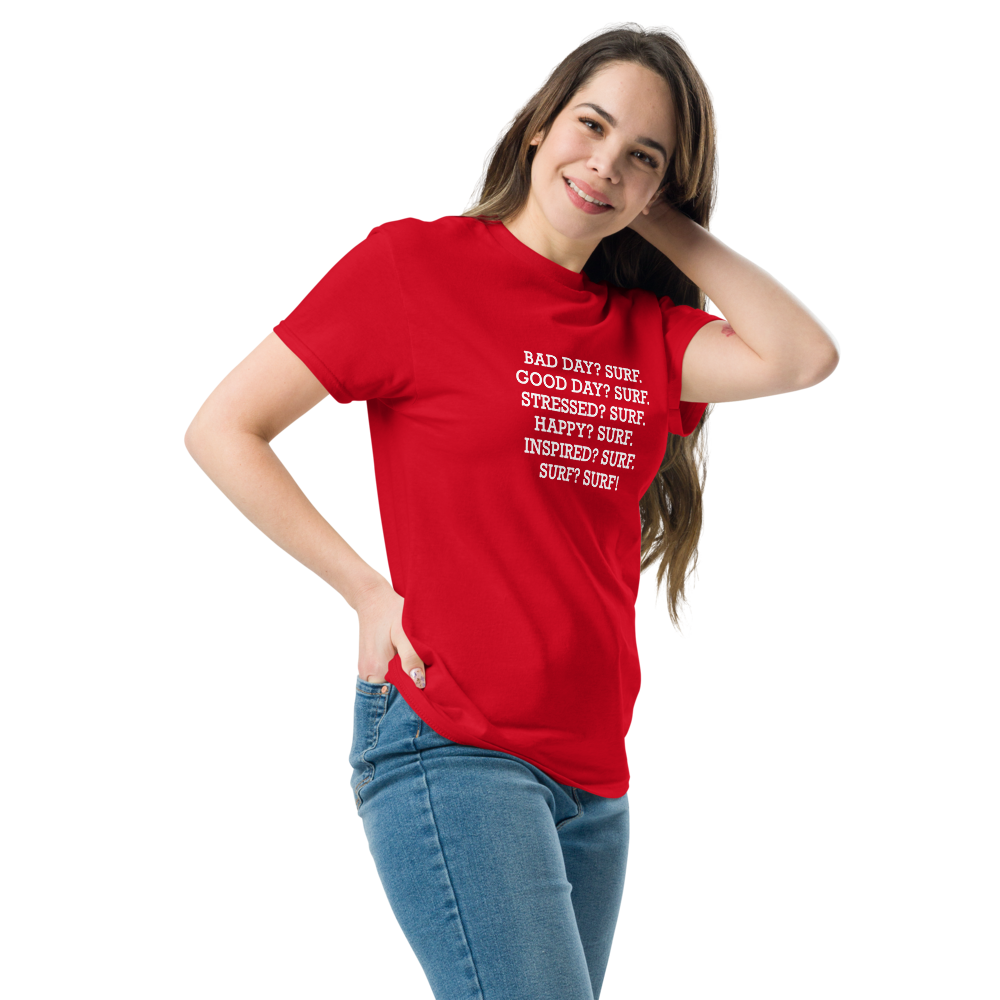 "Bad Day? Surf. Good Day? Surf. Stressed? Surf. Happy? Surf. Inspired? Surf. Surf? Surf!" printed on a red unisex classic tee worn by a female