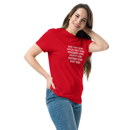 "Bad Day? Surf. Good Day? Surf. Stressed? Surf. Happy? Surf. Inspired? Surf. Surf? Surf!" printed on a red unisex classic tee worn by a female