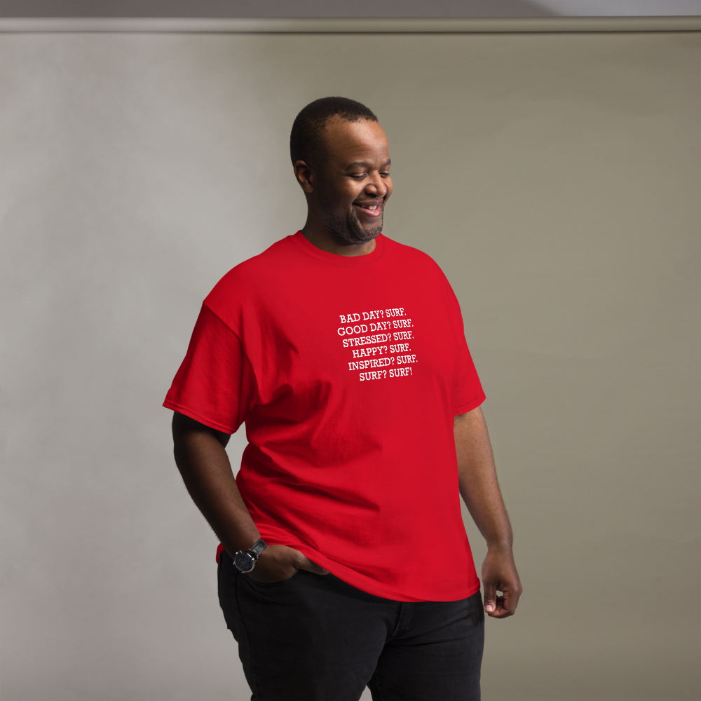 "Bad Day? Surf. Good Day? Surf. Stressed? Surf. Happy? Surf. Inspired? Surf. Surf? Surf!" printed on a red unisex classic tee worn by a male