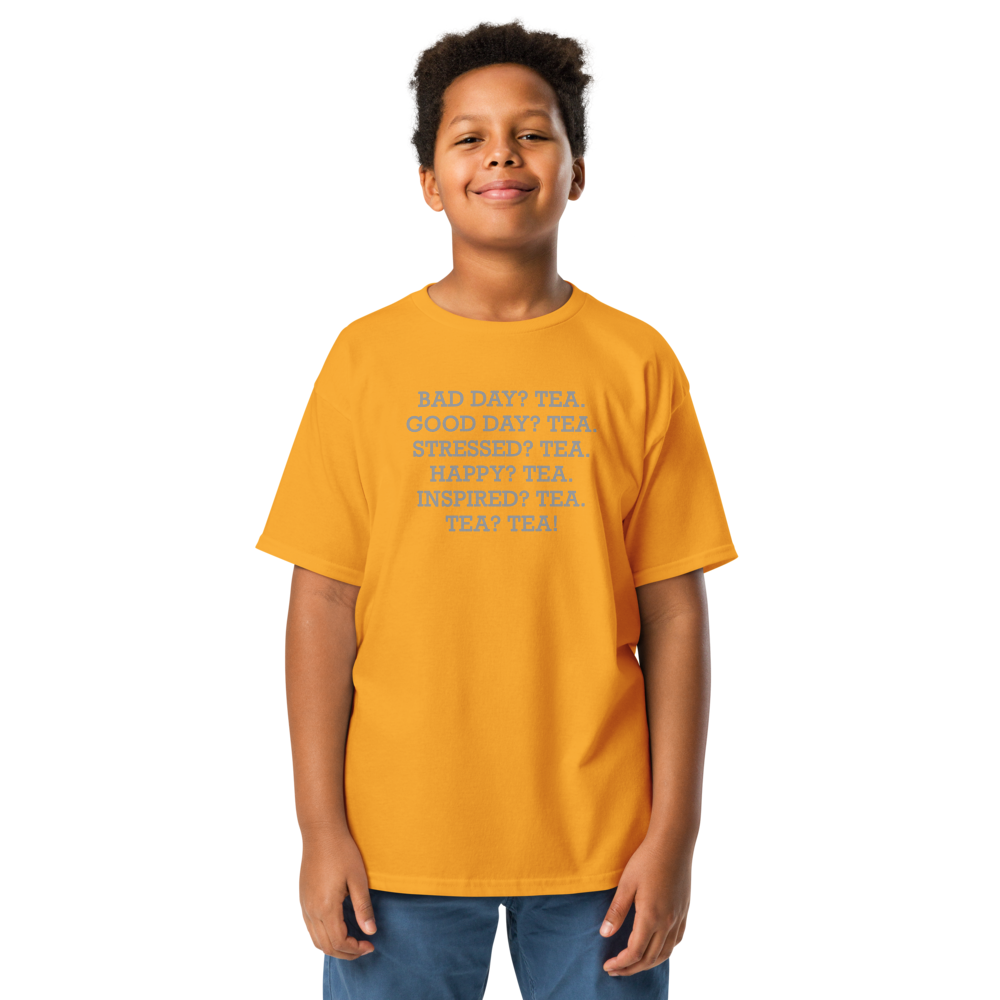 "Bad Day? Tea. Good Day? Tea. Stressed? Tea. Happy? Tea. Inspired? Tea. Tea? Tea!" printed on a gold youth classic tee worn by a male