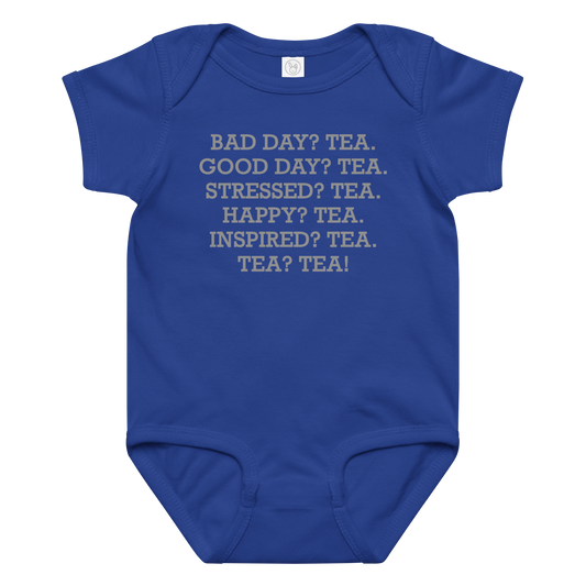 "Bad Day? Tea. Good Day? Tea. Stressed? Tea. Happy? Tea. Inspired? Tea. Tea? Tea!" printed on a royal baby jersey bodysuit laying on a flat surface amongst other clothes