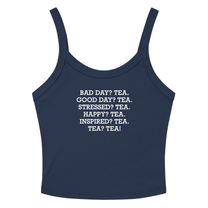 "Bad Day? Tea. Good Day? Tea. Stressed? Tea. Happy? Tea. Inspired? Tea. Tea? Tea!" printed on a solid navy blend women's micro-rib tanktop laying on a flat surface amongst sunglasses and shorts
