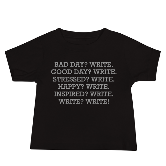 "Bad Day? Write. Good Day? Write. Stressed? Write. Happy? Write. Inspired? Write. Write? Write!" printed on a black baby jersey short sleeve tee laying on a flat surface