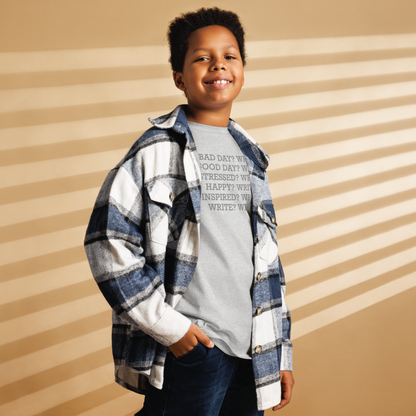 "Bad Day? Write. Good Day? Write. Stressed? Write. Happy? Write. Inspired? Write. Write? Write!" printed on a sport grey youth classic tee worn by a male also wearing a jacket