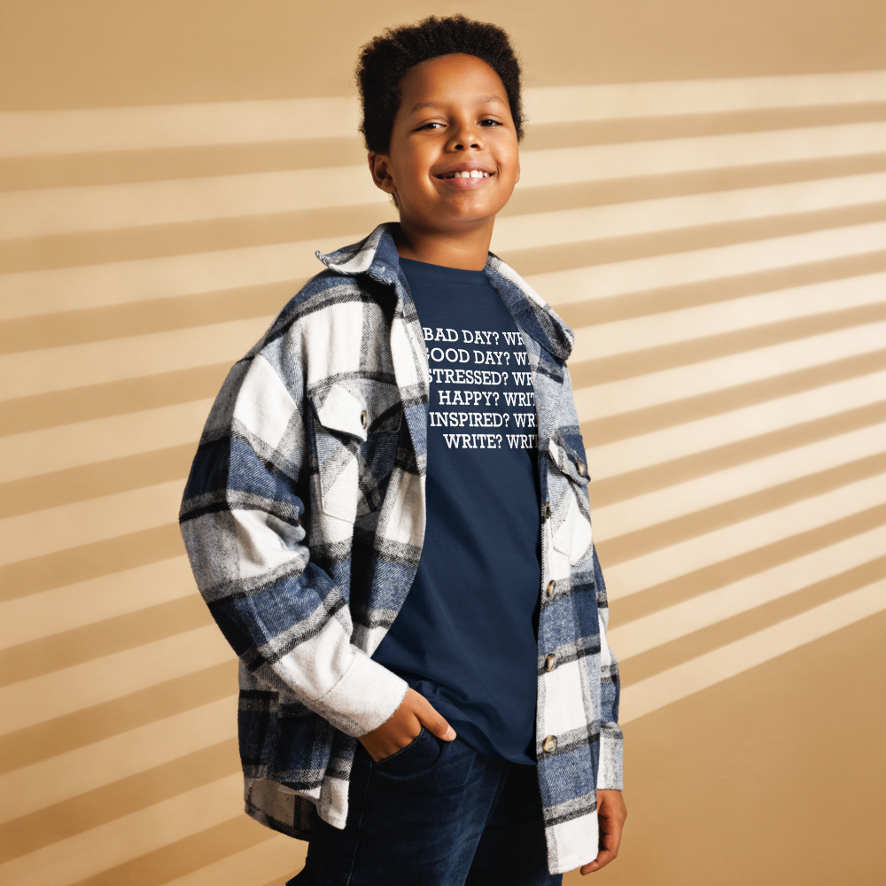 "Bad Day? Write. Good Day? Write. Stressed? Write. Happy? Write. Inspired? Write. Write? Write!" printed on a navy youth classic tee worn by a male also wearing a jacket