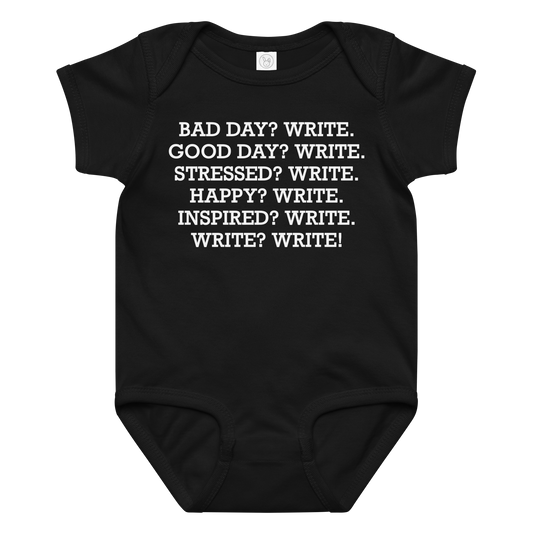 "Bad Day? Write. Good Day? Write. Stressed? Write. Happy? Write. Inspired? Write. Write? Write!" printed on a black baby jersey bodysuit laying on a flat surface amongst other clothes
