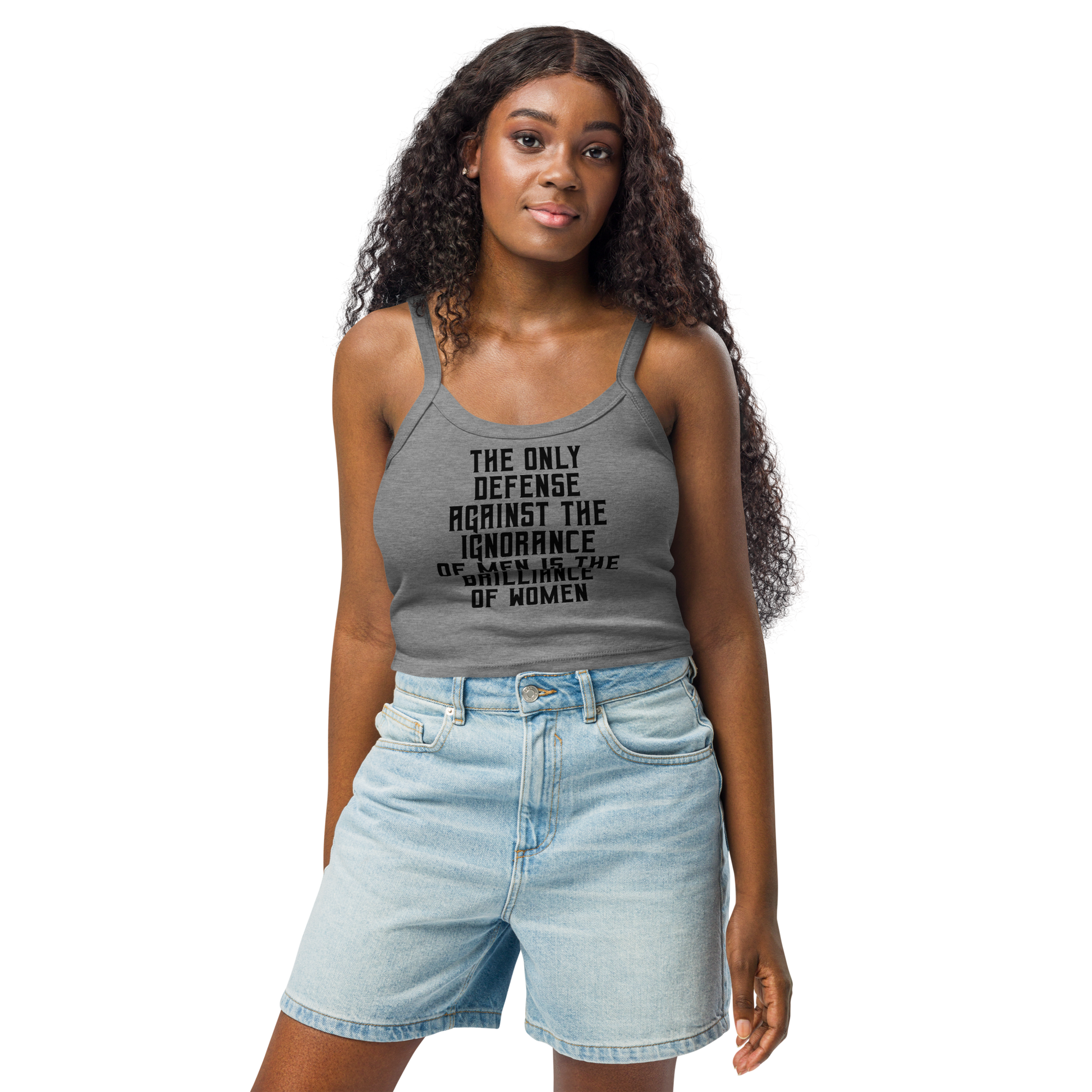 "The Only defense against the ignorance of men is the brilliance of women" printed on a athletic heather women's micro-rib tanktop worn by a female