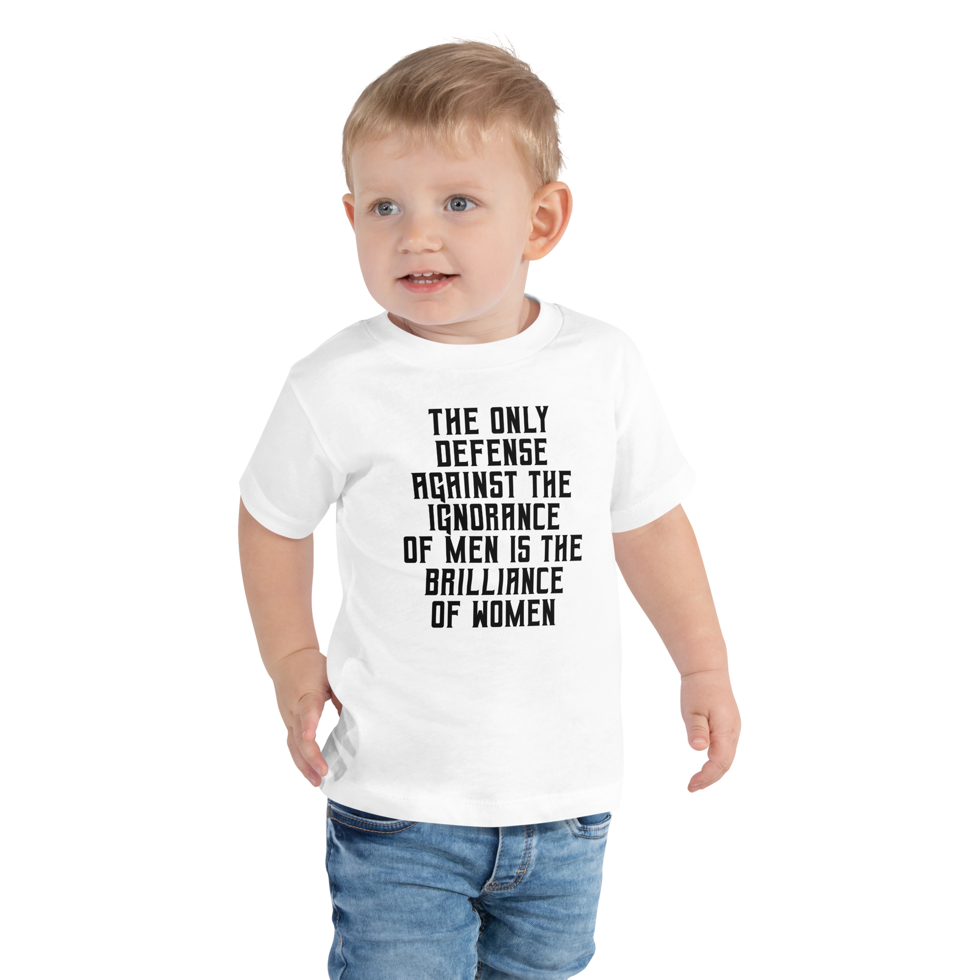 "The Only defense against the ignorance of men is the brilliance of women" printed on a white toddler short sleeve tee worn by a male