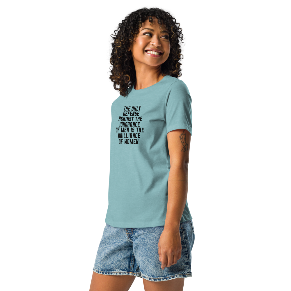 "The Only defense against the ignorance of men is the brilliance of women" printed on a heather blue lagoon women's relaxed t-shirt worn by a female