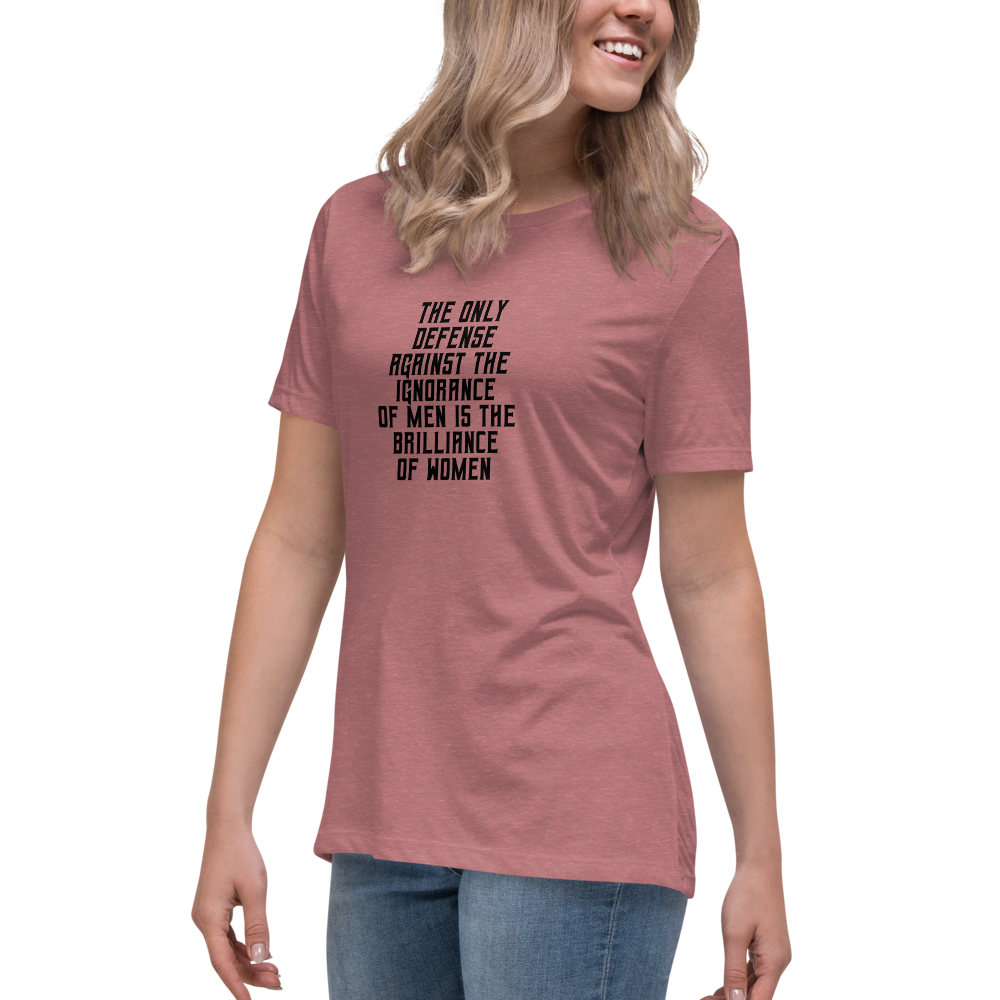 "The Only defense against the ignorance of men is the brilliance of women" printed on a heather mauve women's relaxed t-shirt worn by a female