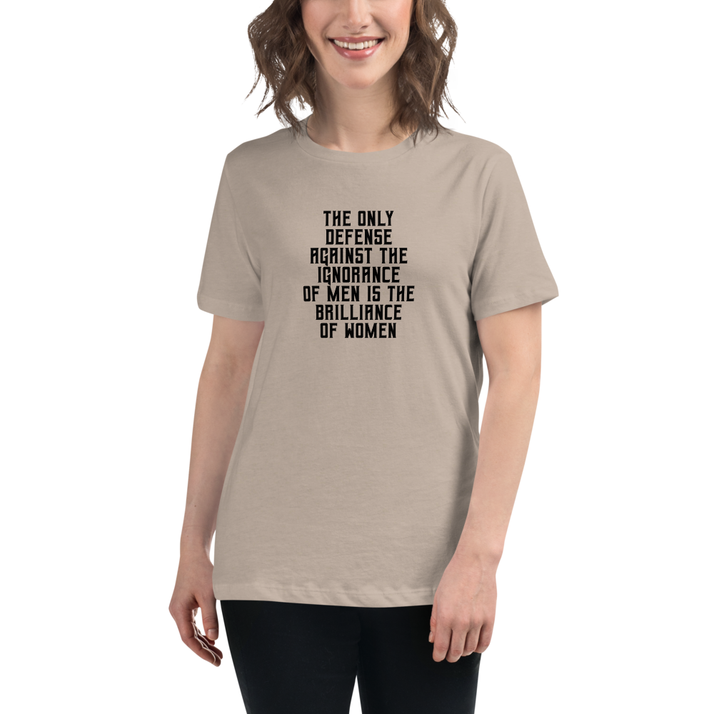 "The Only defense against the ignorance of men is the brilliance of women" printed on a heather stone women's relaxed t-shirt worn by a female