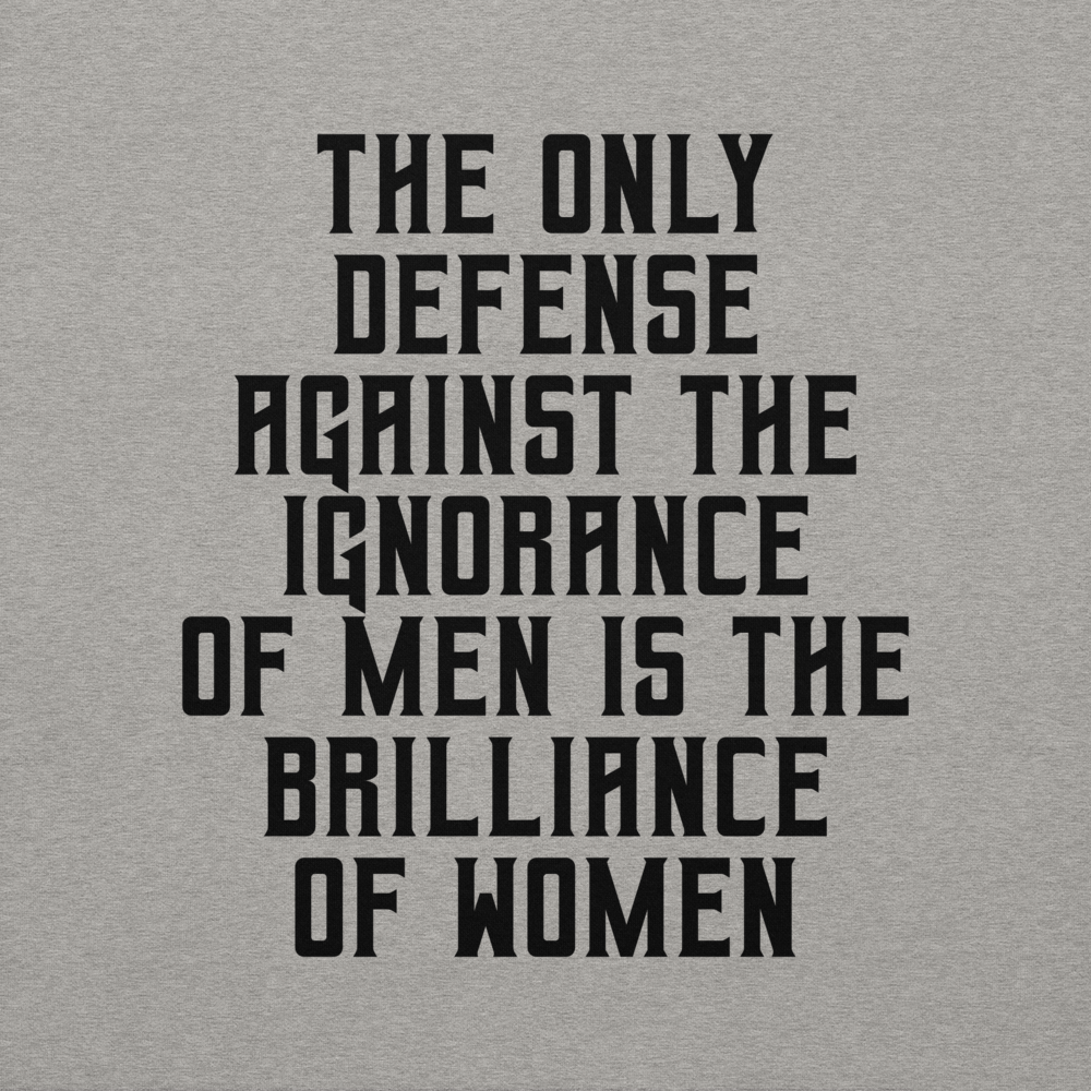 "The Only defense against the ignorance of men is the brilliance of women" printed on a carbon grey background