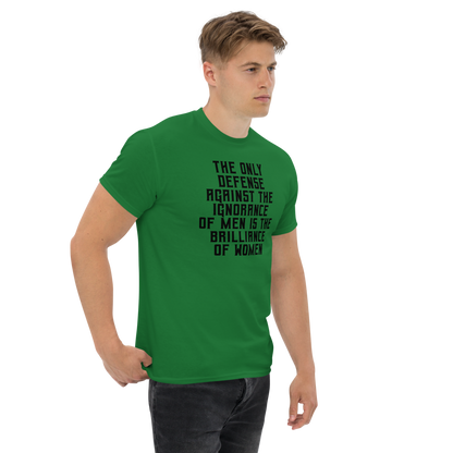 "The Only defense against the ignorance of men is the brilliance of women" printed on a turf green unisex classic tee worn by a male