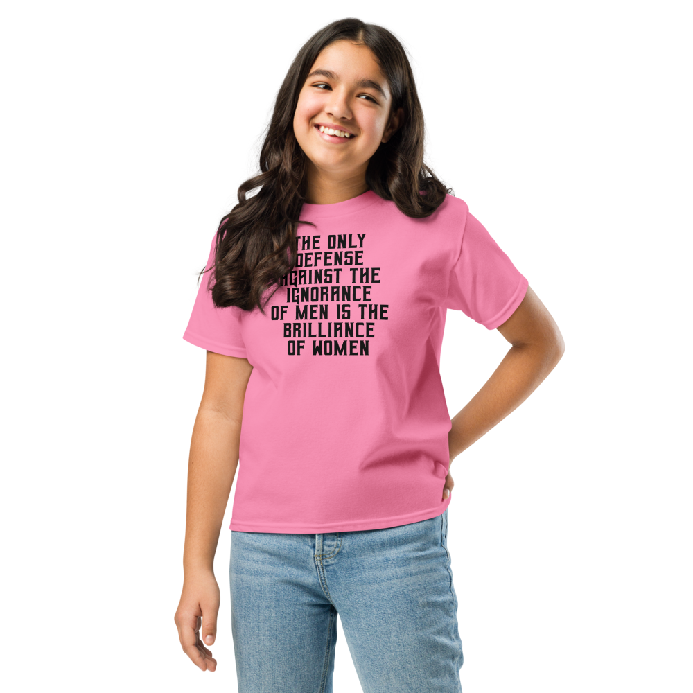 "The Only defense against the ignorance of men is the brilliance of women" printed on a azalea youth classic tee worn by a female