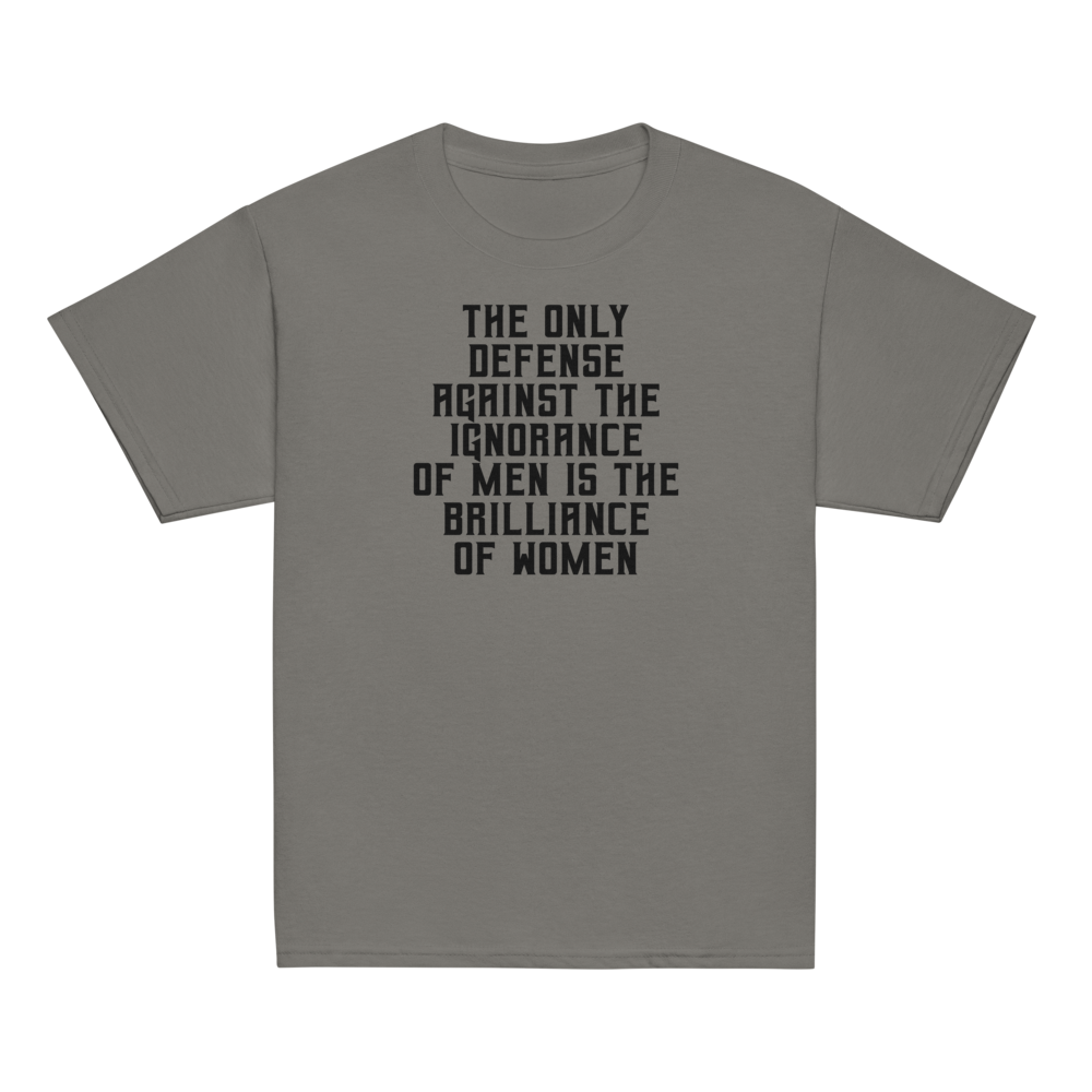 "The Only defense against the ignorance of men is the brilliance of women" printed on a charcoal youth classic tee laying on a flat surface