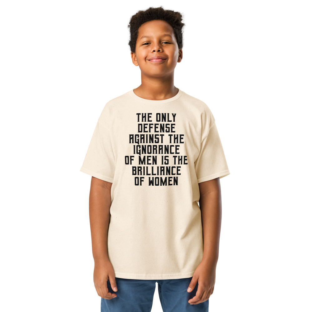 "The Only defense against the ignorance of men is the brilliance of women" printed on a natural youth classic tee worn by a male
