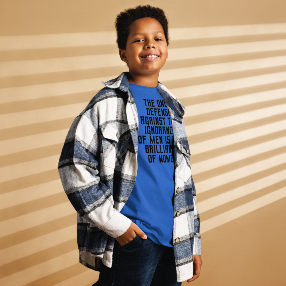 "The Only defense against the ignorance of men is the brilliance of women" printed on a royal youth classic tee worn by a male also wearing a jacket