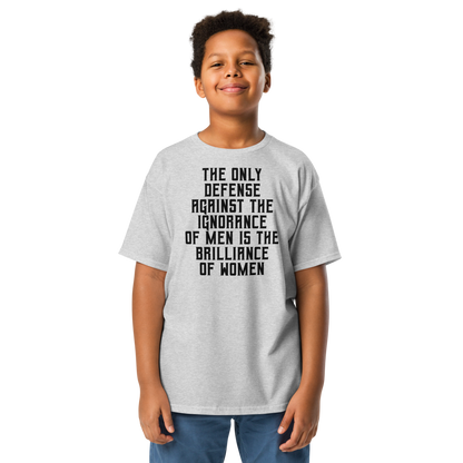 "The Only defense against the ignorance of men is the brilliance of women" printed on a sport grey youth classic tee worn by a male