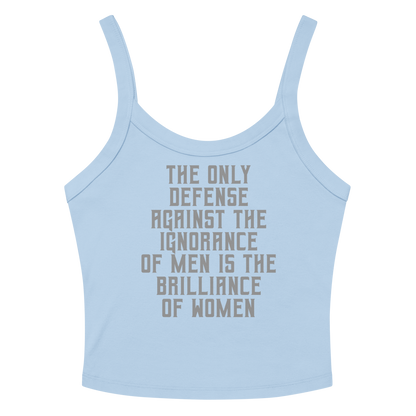 "The Only defense against the ignorance of men is the brilliance of women" printed on a solid baby blue blend women's micro-rib tanktop laying on a flat surface amongst sunglasses and shorts