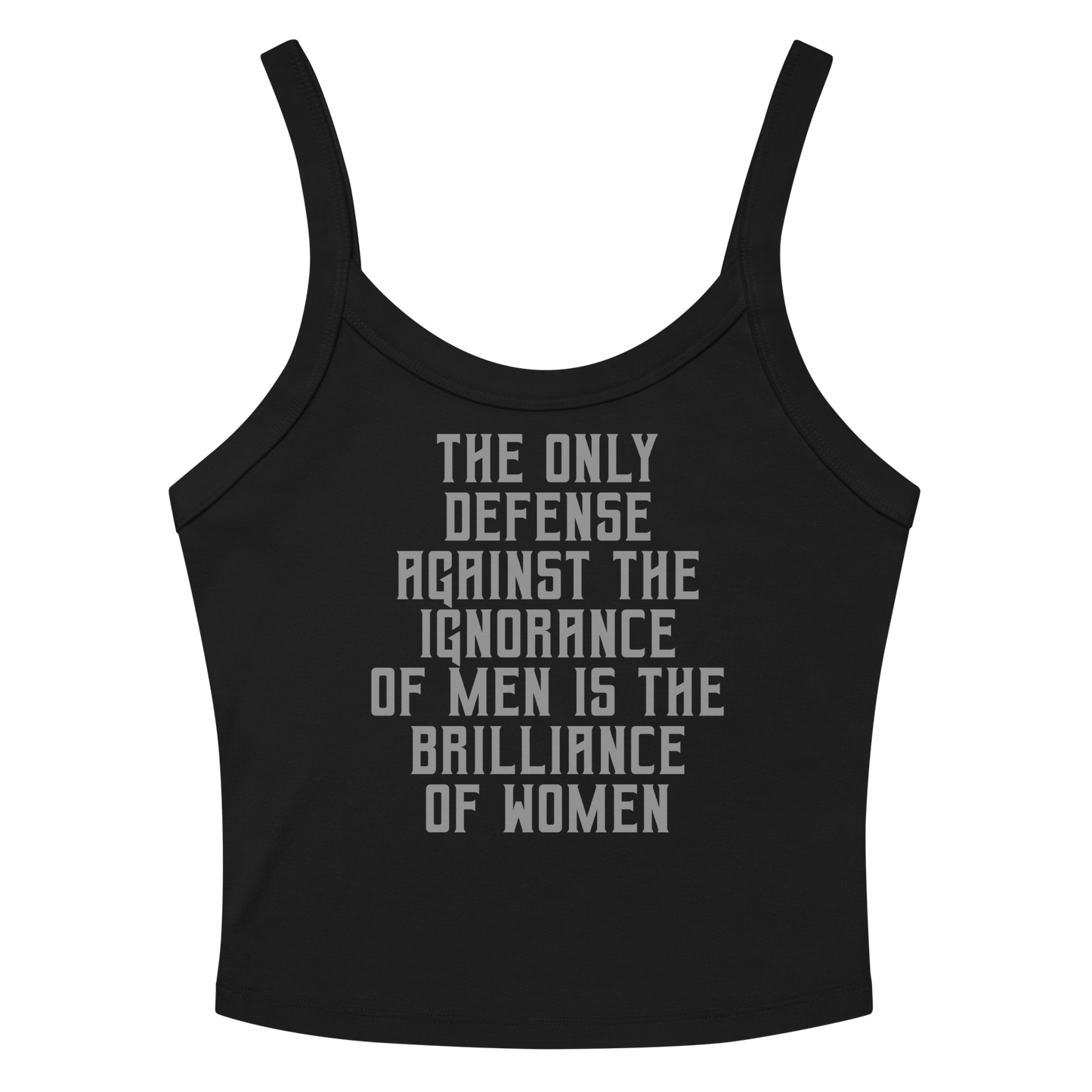 "The Only defense against the ignorance of men is the brilliance of women" printed on a solid black blend women's micro-rib tanktop laying on a flat surface amongst sunglasses and shorts