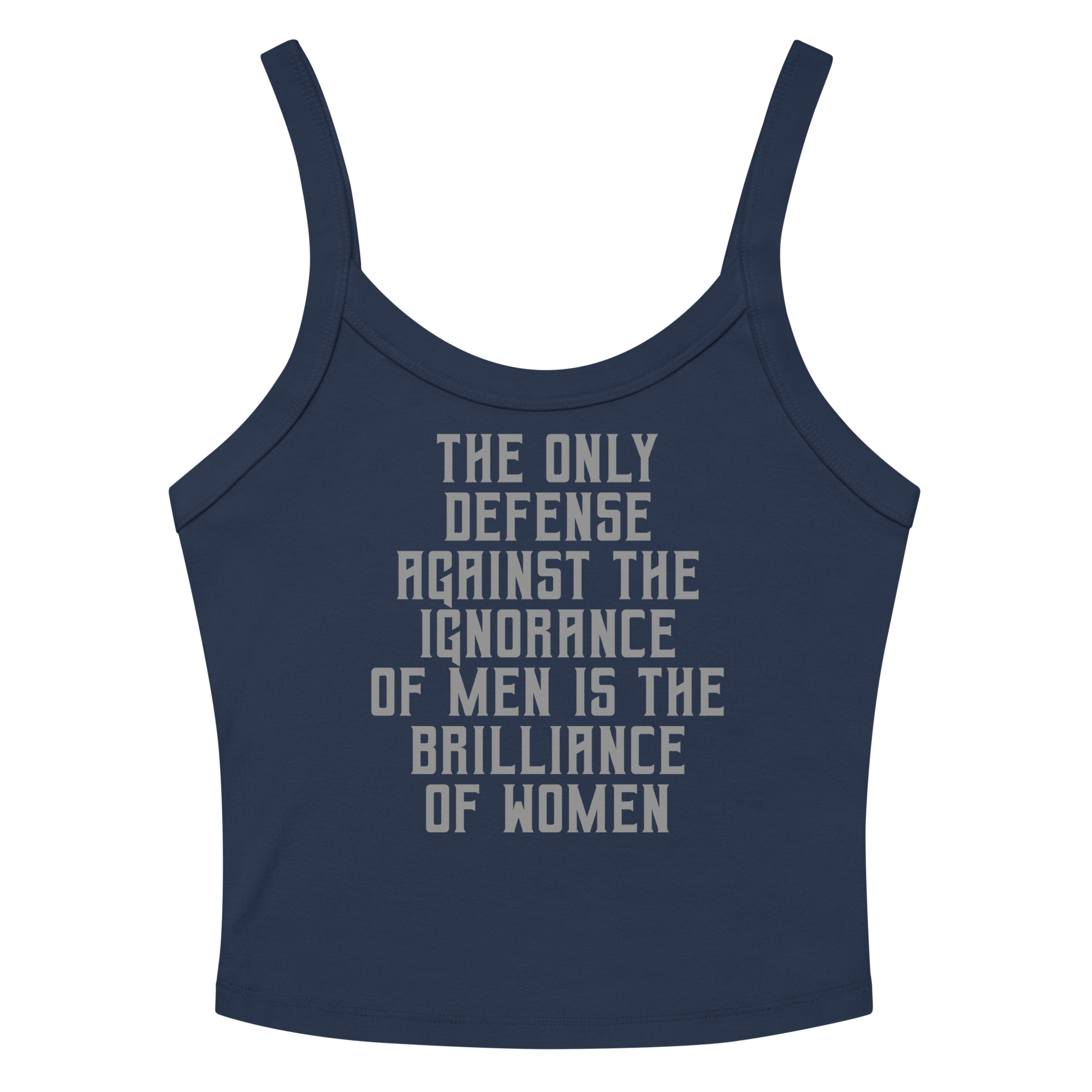 "The Only defense against the ignorance of men is the brilliance of women" printed on a solid navy blend women's micro-rib tanktop laying on a flat surface amongst sunglasses and shorts