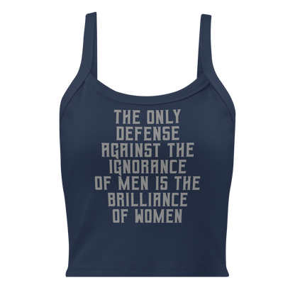 "The Only defense against the ignorance of men is the brilliance of women" printed on a solid navy blend women's micro-rib tanktop laying on a flat surface