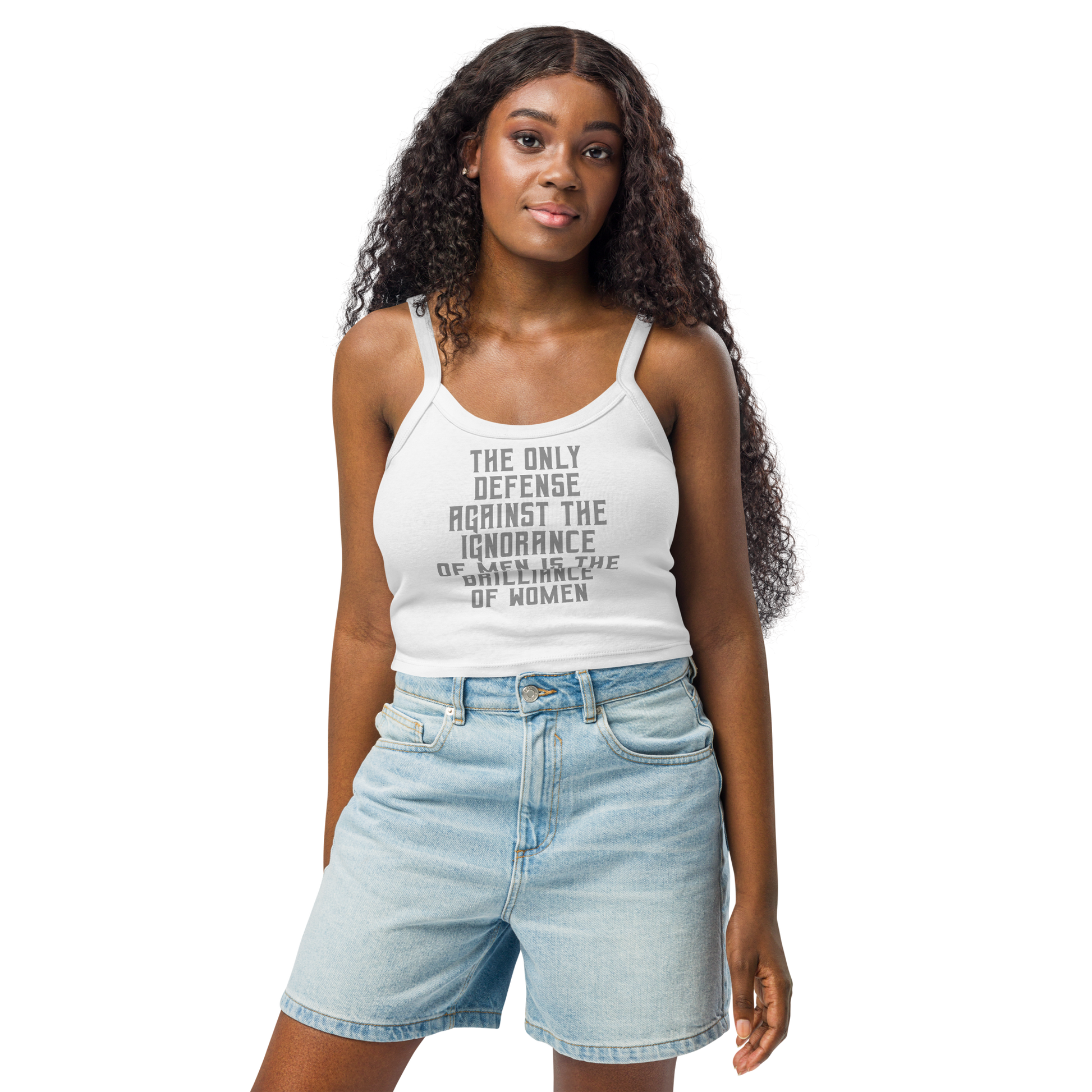 "The Only defense against the ignorance of men is the brilliance of women" printed on a solid white blend women's micro-rib tanktop worn by a female