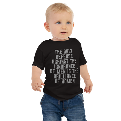 "The Only defense against the ignorance of men is the brilliance of women" printed on a black baby jersey short sleeve tee worn by a male