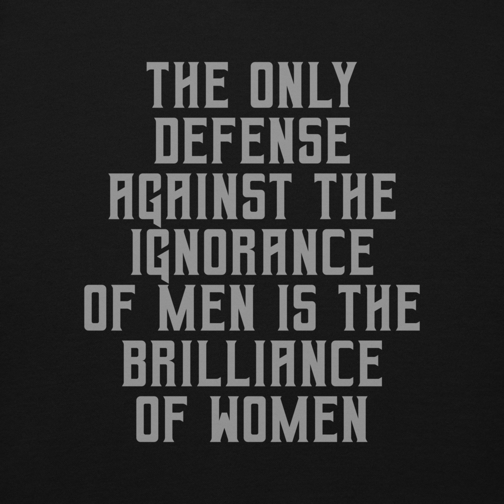 "The Only defense against the ignorance of men is the brilliance of women" printed on a black background