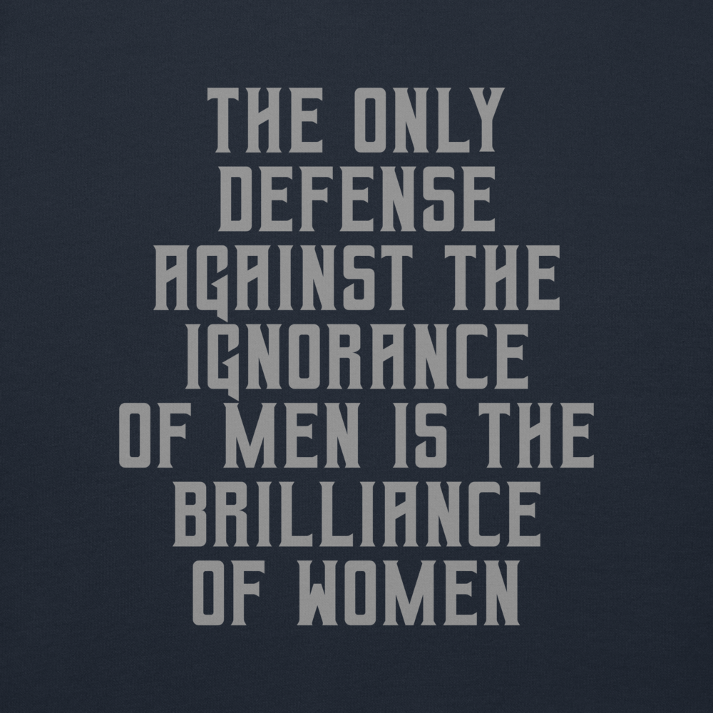 "The Only defense against the ignorance of men is the brilliance of women" printed on a navy blazer background