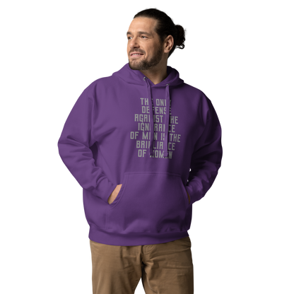 "The Only defense against the ignorance of men is the brilliance of women" printed on a purple unisex hoodie worn by a male
