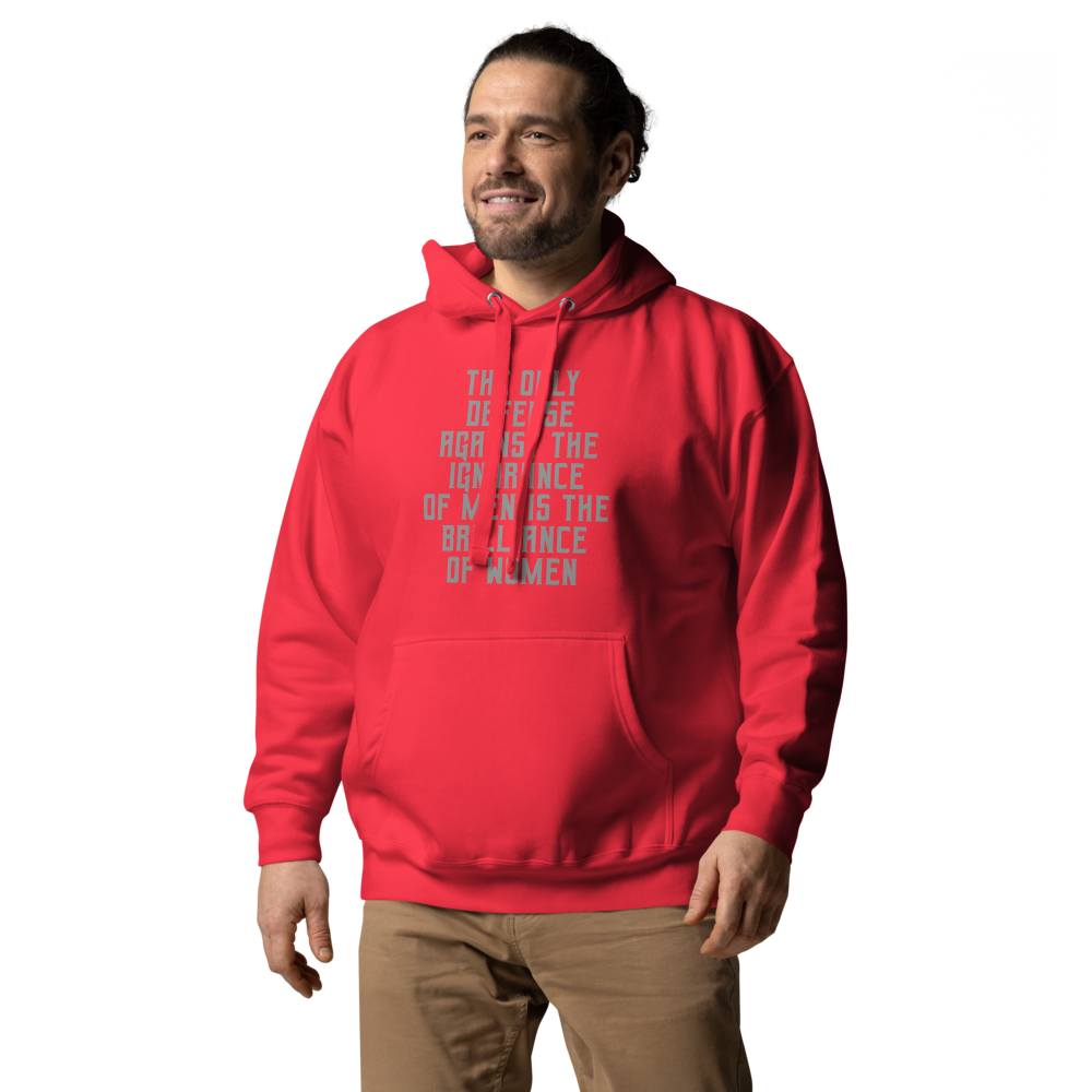 "The Only defense against the ignorance of men is the brilliance of women" printed on a team red unisex hoodie worn by a male