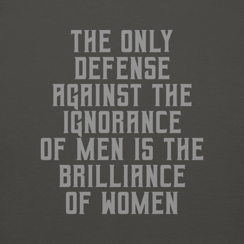 "The Only defense against the ignorance of men is the brilliance of women" printed on a vintage black background