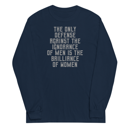 "The Only defense against the ignorance of men is the brilliance of women" printed on a navy men's long sleeve shirt laying on a flat surface