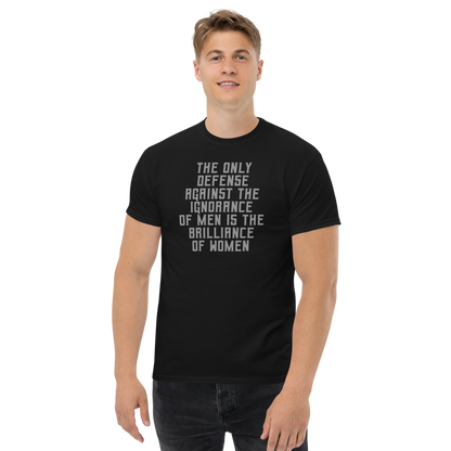 "The Only defense against the ignorance of men is the brilliance of women" printed on a black unisex classic tee worn by a male