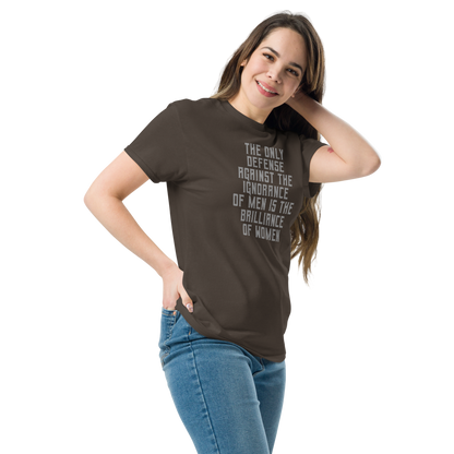 "The Only defense against the ignorance of men is the brilliance of women" printed on a dark chocolate unisex classic tee worn by a female
