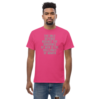 "The Only defense against the ignorance of men is the brilliance of women" printed on a heliconia unisex classic tee worn by a male