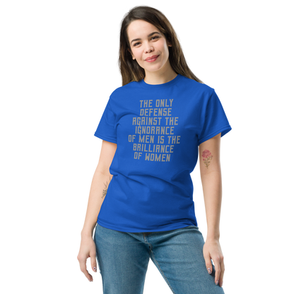 "The Only defense against the ignorance of men is the brilliance of women" printed on a royal unisex classic tee worn by a female