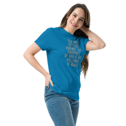 "The Only defense against the ignorance of men is the brilliance of women" printed on a sapphire unisex classic tee worn by a female