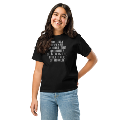 "The Only defense against the ignorance of men is the brilliance of women" printed on a black youth classic tee worn by a female