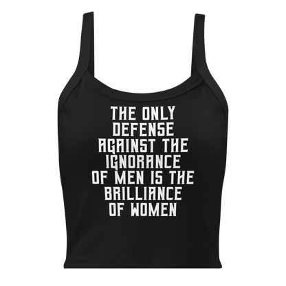 "The Only defense against the ignorance of men is the brilliance of women" printed on a solid black blend women's micro-rib tanktop laying on a flat surface
