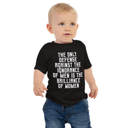 "The Only defense against the ignorance of men is the brilliance of women" printed on a black baby jersey short sleeve tee worn by a male