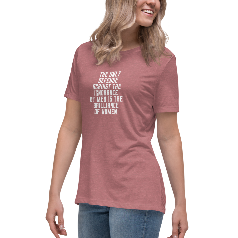 "The Only defense against the ignorance of men is the brilliance of women" printed on a heather mauve women's relaxed t-shirt worn by a female