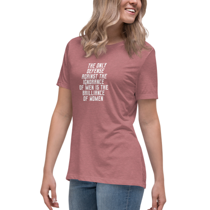 "The Only defense against the ignorance of men is the brilliance of women" printed on a heather mauve women's relaxed t-shirt worn by a female